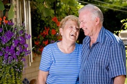 elderly couple laughing together